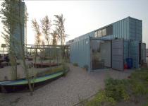 Wijn of Water Shipping Container Restaurant.  Commercial prefab green shipping container sustainable architecture.